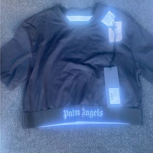 I am selling a brand new palm angels shirt in a women’s size medium, runs fitted